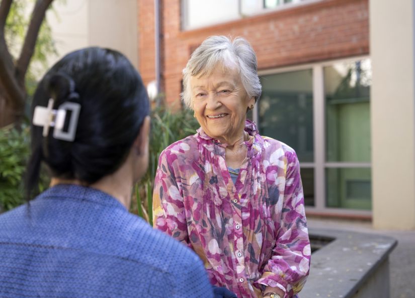 Eldercare Evanston Park resident talking to a staff member