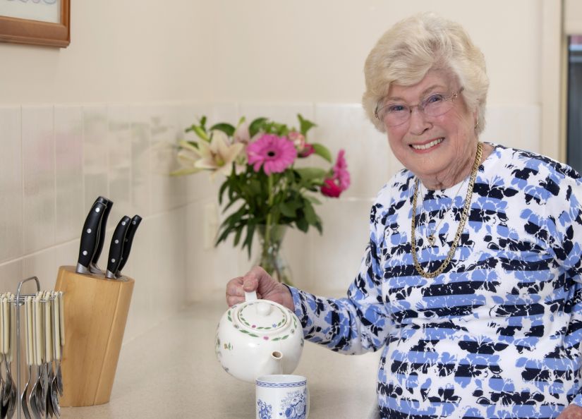 Eldercare retirement living resident making a cup of tea