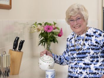 Eldercare retirement living resident making a cup of tea