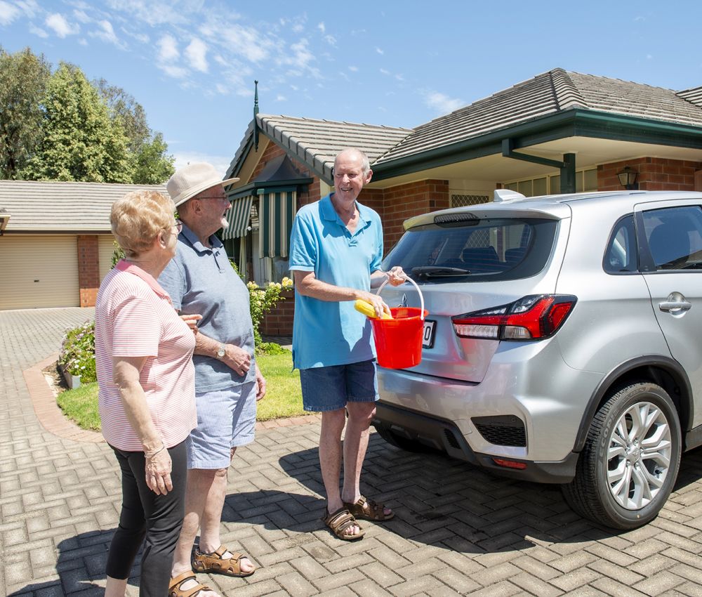 Eldercare Old Oxford Retirement Living residents talking and smiling at each other.