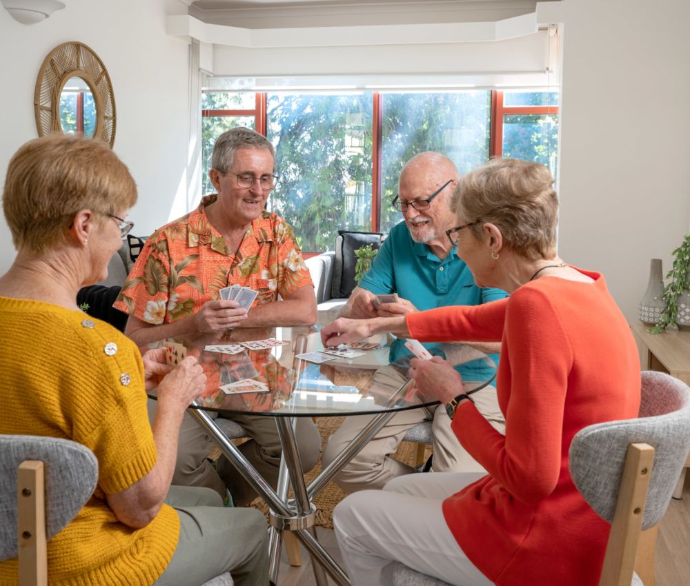Eldercare Kingsborough Retirement Living residents playing cards.