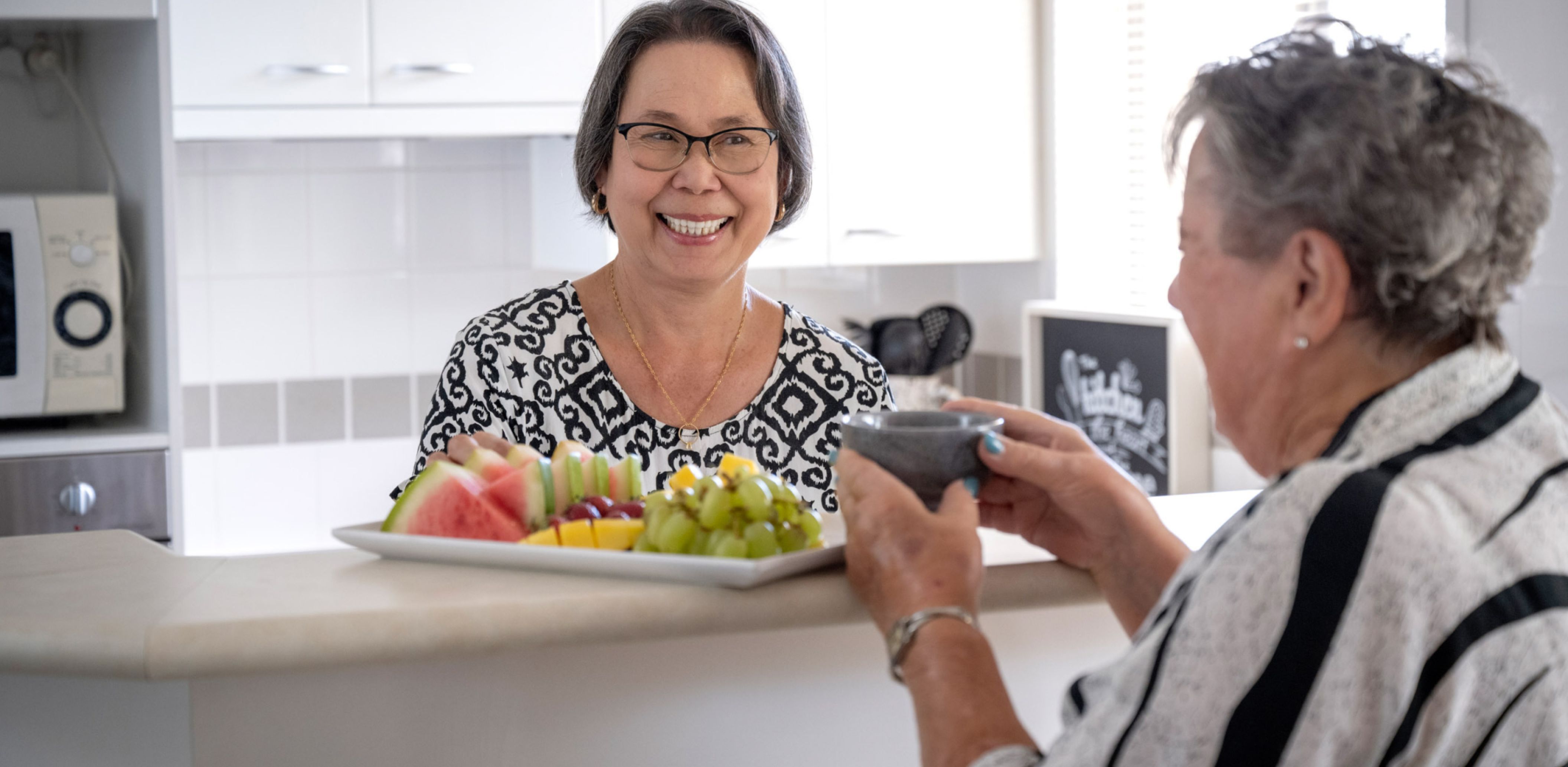 Eldercare Sash Ferguson Retirement Living residents in the kitchen