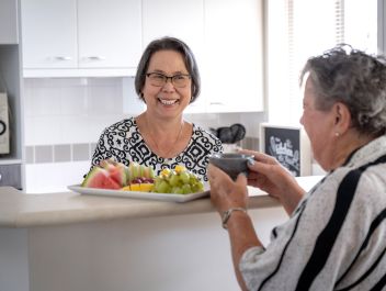 Eldercare Sash Ferguson Retirement Living residents in the kitchen
