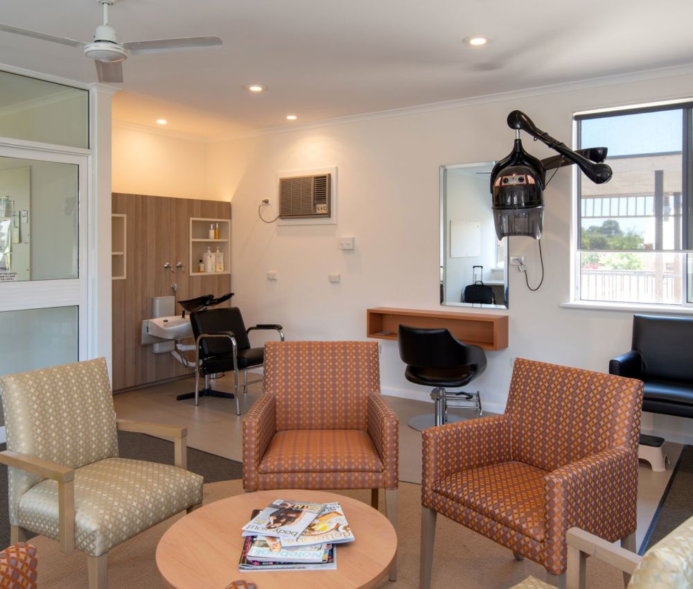 Eldercare College Green Retirement Living community room and hairdresser.